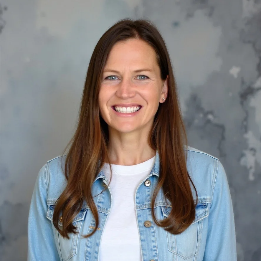 Wendy Copeland smiling in a denim jacket